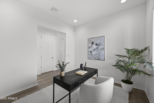 home office with recessed lighting, wood finished floors, visible vents, and baseboards