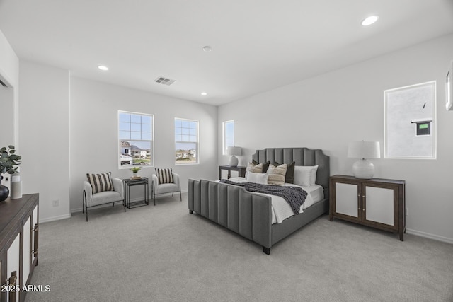 bedroom featuring recessed lighting, visible vents, light colored carpet, and baseboards