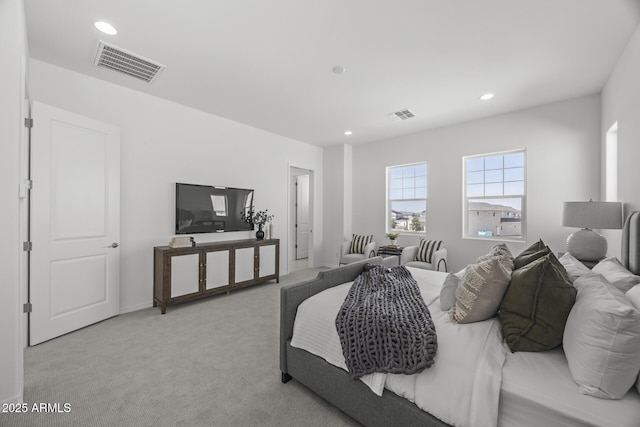 bedroom with recessed lighting, light colored carpet, and visible vents