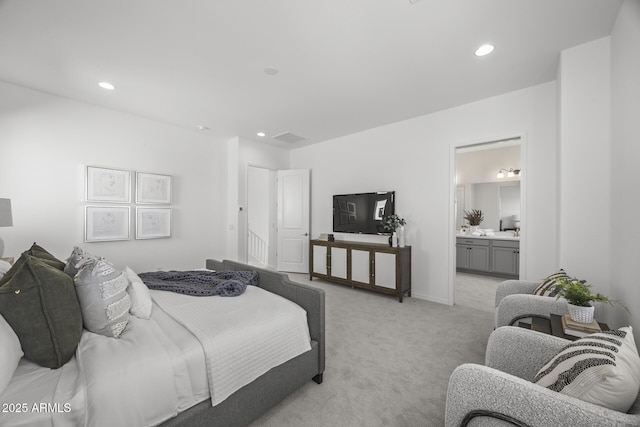 bedroom with visible vents, connected bathroom, baseboards, light carpet, and recessed lighting