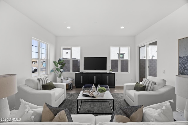 living area with recessed lighting and wood finished floors