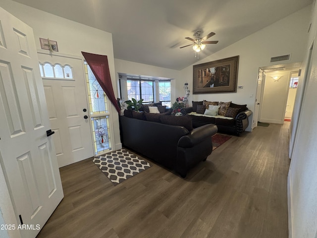 living room with ceiling fan, dark hardwood / wood-style flooring, and lofted ceiling