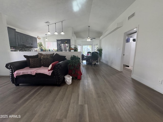 living room with dark hardwood / wood-style floors, ceiling fan, and lofted ceiling