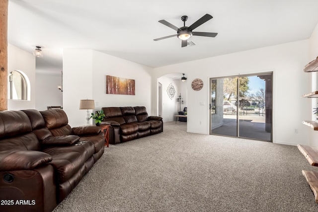 living room with carpet, vaulted ceiling, and ceiling fan