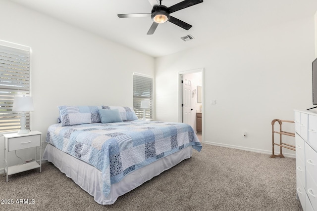 carpeted bedroom featuring visible vents, ceiling fan, baseboards, and multiple windows