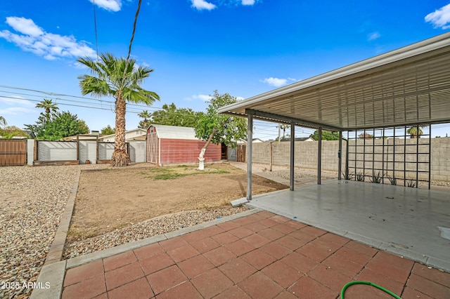 view of patio / terrace with a storage shed