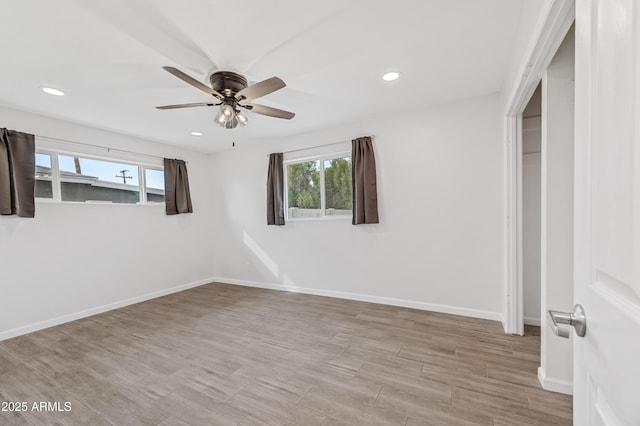 unfurnished bedroom featuring ceiling fan and light hardwood / wood-style floors