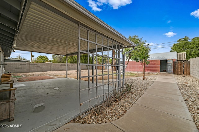 view of patio / terrace with an outbuilding