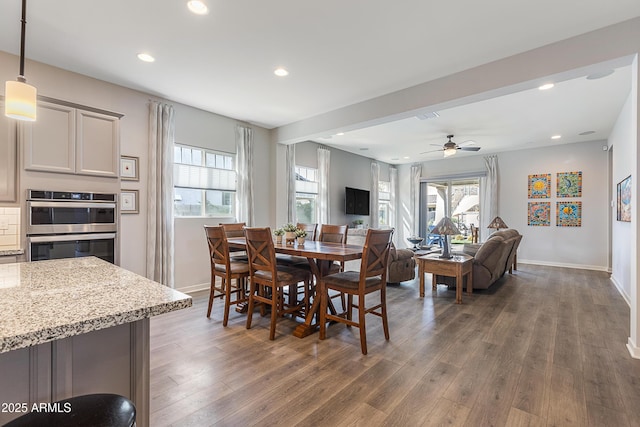 dining room with baseboards, ceiling fan, wood finished floors, and recessed lighting