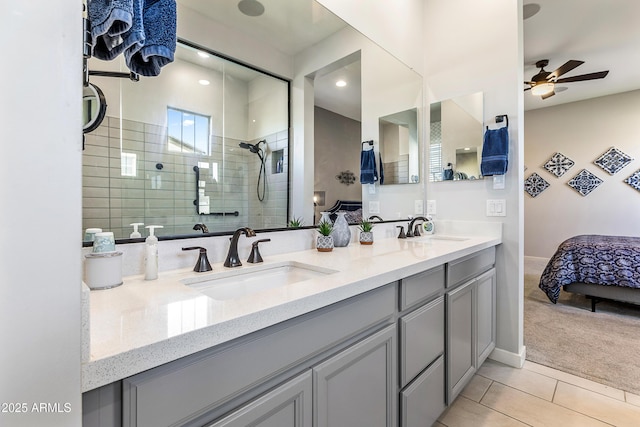 bathroom with connected bathroom, a sink, a tile shower, and tile patterned floors