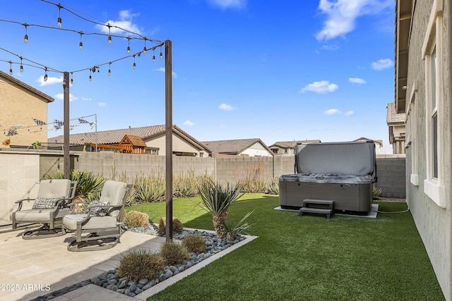 view of yard with a fenced backyard, a patio, and a hot tub