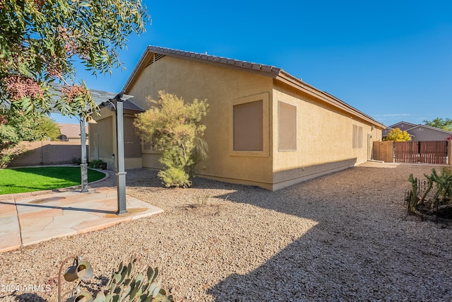 view of home's exterior featuring a patio area