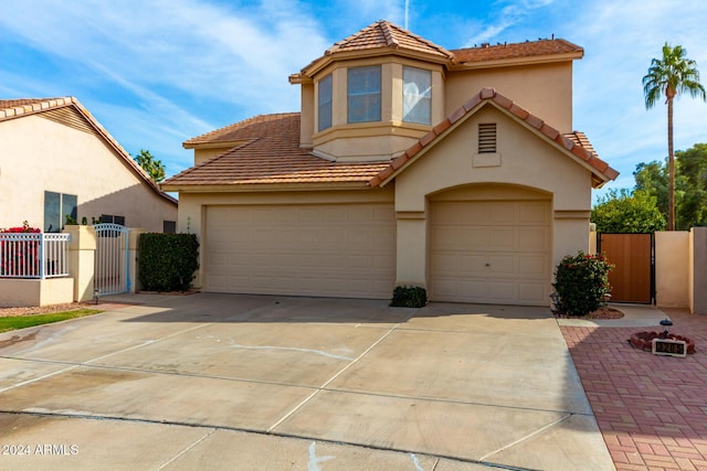 mediterranean / spanish-style house featuring a garage