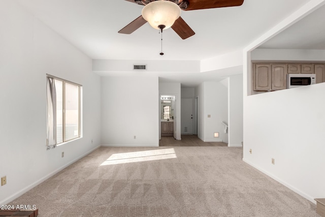 interior space with ceiling fan