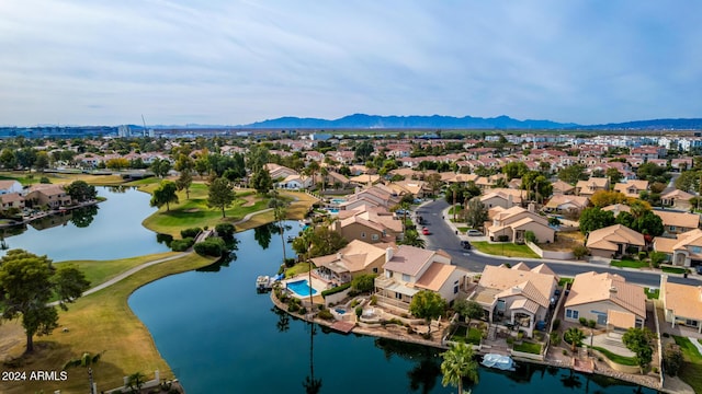 bird's eye view with a water and mountain view