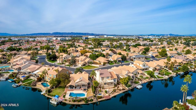 drone / aerial view with a water and mountain view