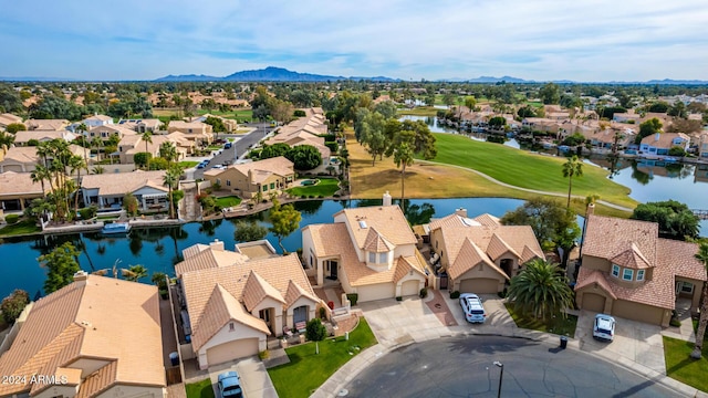 bird's eye view with a water and mountain view