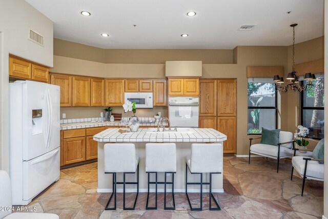 dining area with sink and ceiling fan