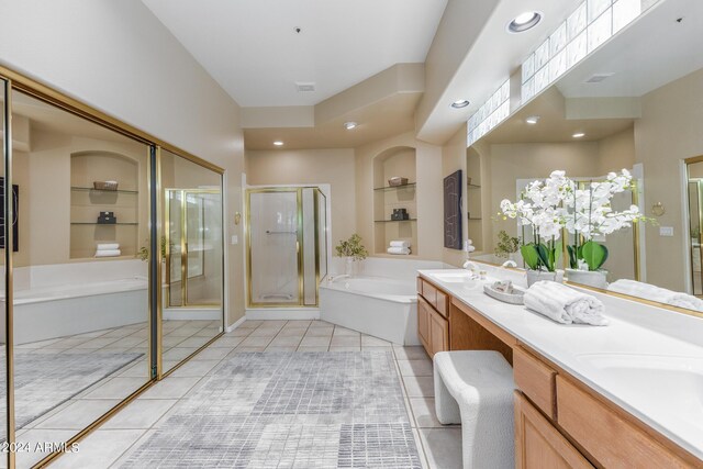 bathroom featuring tile patterned flooring, vanity, and plus walk in shower