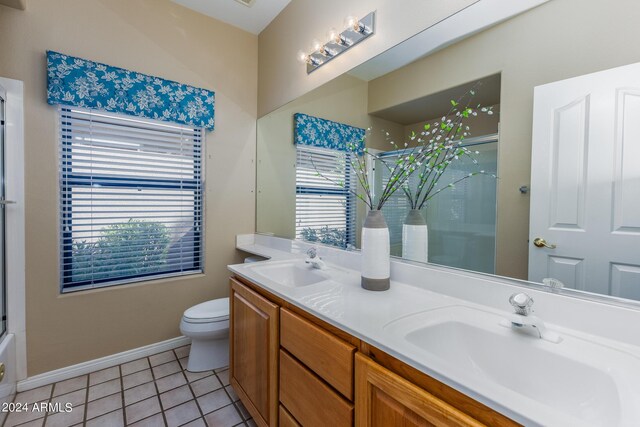 full bathroom featuring plus walk in shower, tile patterned floors, vanity, and toilet