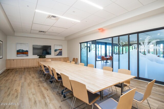 gym with a healthy amount of sunlight and a paneled ceiling