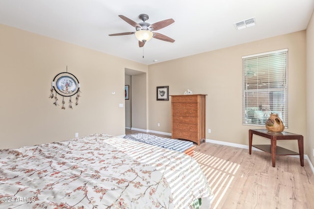 bedroom with light wood-type flooring and ceiling fan