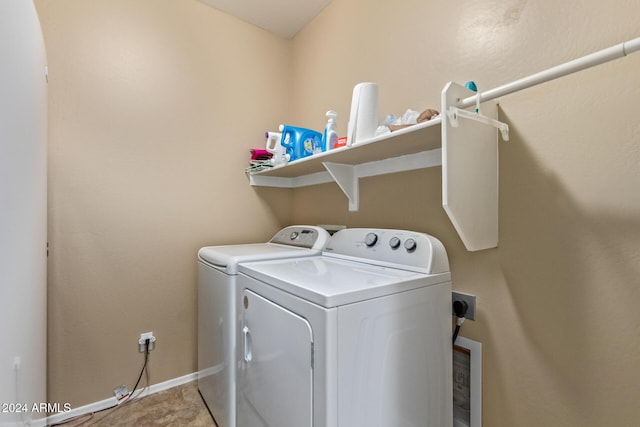 clothes washing area featuring washer and clothes dryer