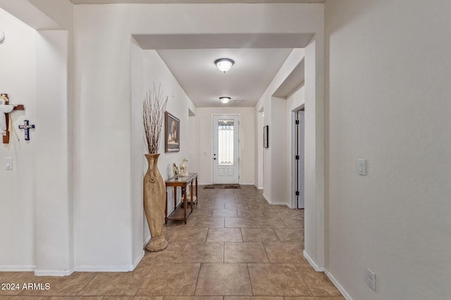 interior space featuring light tile patterned floors