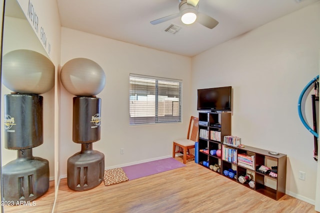 recreation room featuring ceiling fan and hardwood / wood-style floors