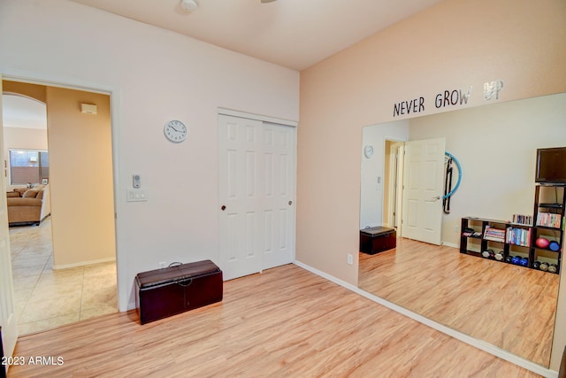 bedroom featuring wood-type flooring and a closet