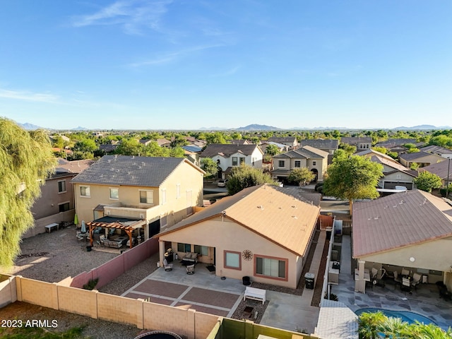 birds eye view of property with a mountain view