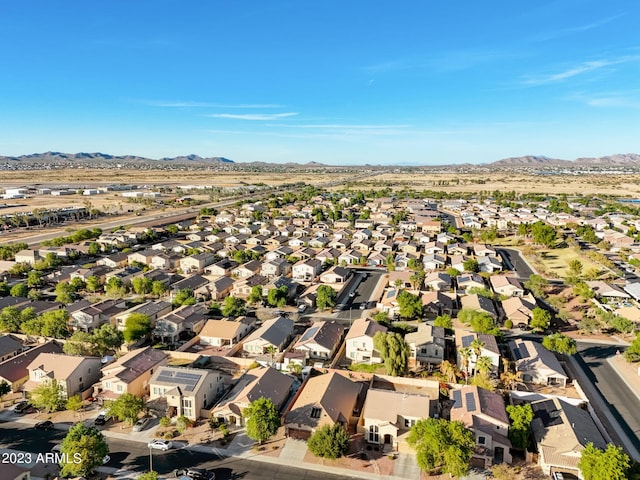 birds eye view of property with a mountain view