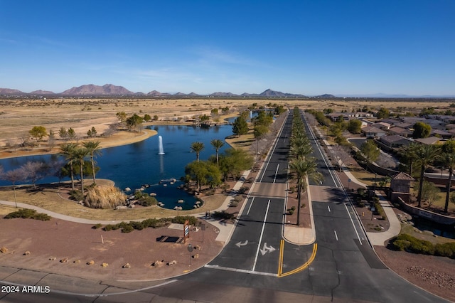 bird's eye view with a water and mountain view