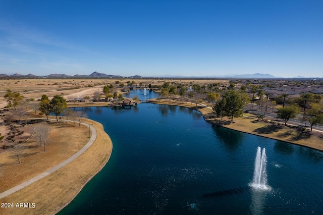 drone / aerial view with a water and mountain view