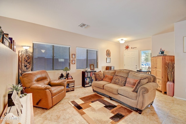 living room with light tile patterned flooring