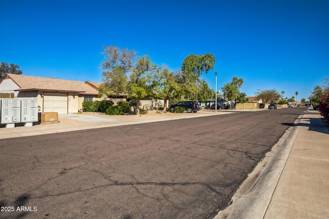 view of road featuring sidewalks and street lighting