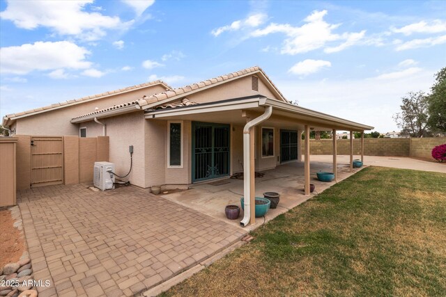 662 S Saddle St, Gilbert, AZ 85233 - rear view of house featuring a gate, stucco siding, a patio, and a tile roof