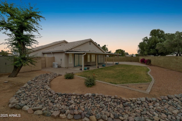 662 S Saddle St, Gilbert, AZ 85233 - rear view of property with a patio area, a tiled roof, and stucco siding