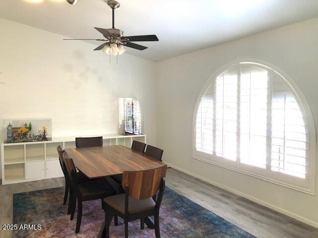 1156 E Vinedo Ln, Tempe, AZ 85284 - dining room with dark wood-type flooring, a ceiling fan, and baseboards