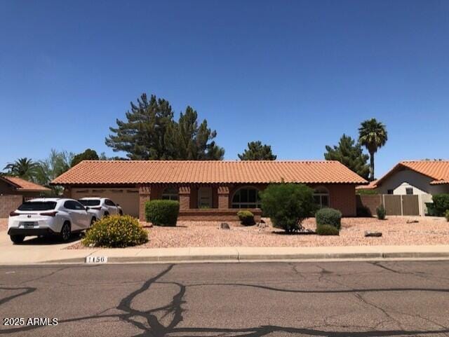 1156 E Vinedo Ln, Tempe, AZ 85284 - single story home featuring a tile roof, a garage, and concrete driveway