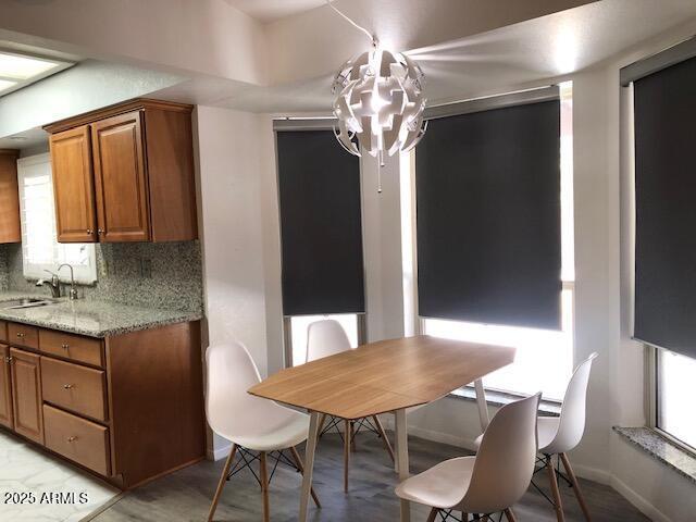 1156 E Vinedo Ln, Tempe, AZ 85284 - dining space with a chandelier, healthy amount of natural light, and baseboards