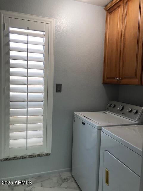 1156 E Vinedo Ln, Tempe, AZ 85284 - laundry area with cabinet space, independent washer and dryer, and light marble finish flooring