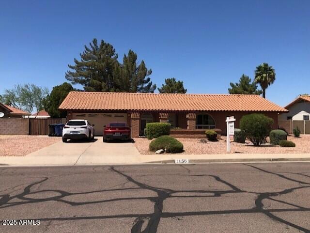 1156 E Vinedo Ln, Tempe, AZ 85284 - ranch-style home featuring a garage, a tiled roof, and driveway