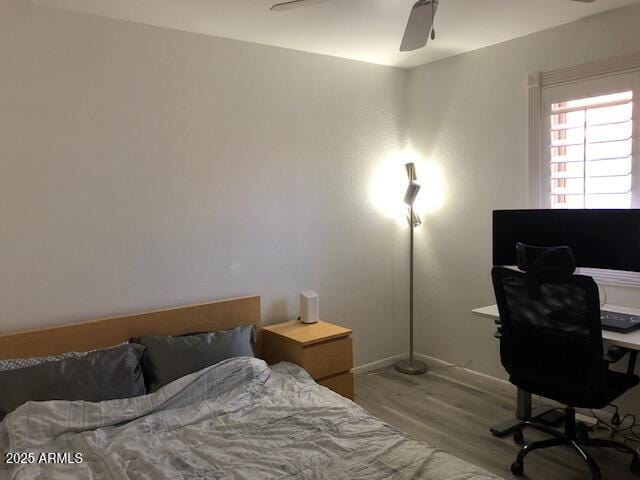 1156 E Vinedo Ln, Tempe, AZ 85284 - bedroom with wood finished floors, a desk, a ceiling fan, and baseboards
