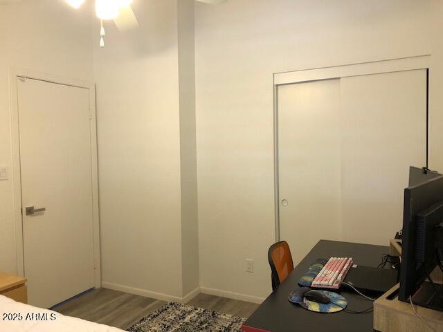 1156 E Vinedo Ln, Tempe, AZ 85284 - office featuring wood finished floors, a ceiling fan, and baseboards