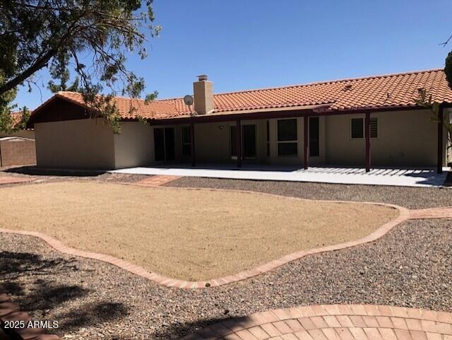 1156 E Vinedo Ln, Tempe, AZ 85284 - rear view of house with a tile roof, a chimney, a patio area, and stucco siding