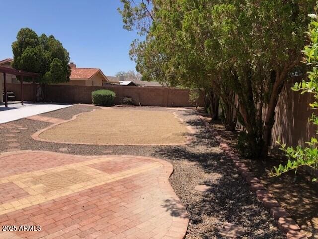 1156 E Vinedo Ln, Tempe, AZ 85284 - fenced backyard with a patio area