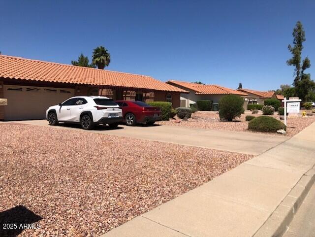1156 E Vinedo Ln, Tempe, AZ 85284 - view of front of property with driveway, an attached garage, and a tiled roof