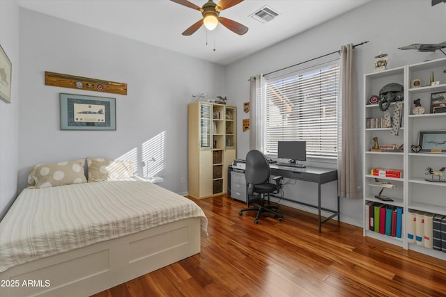 bedroom with ceiling fan and hardwood / wood-style floors