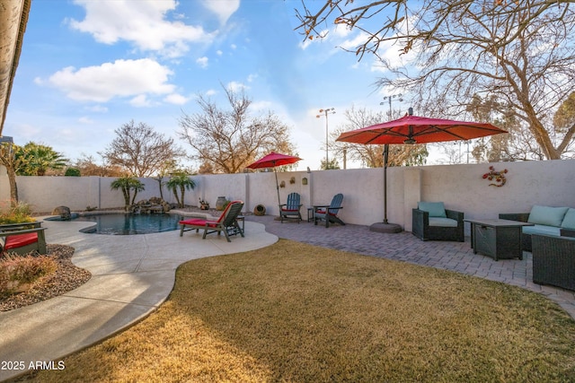 view of yard featuring a patio area and a fenced in pool